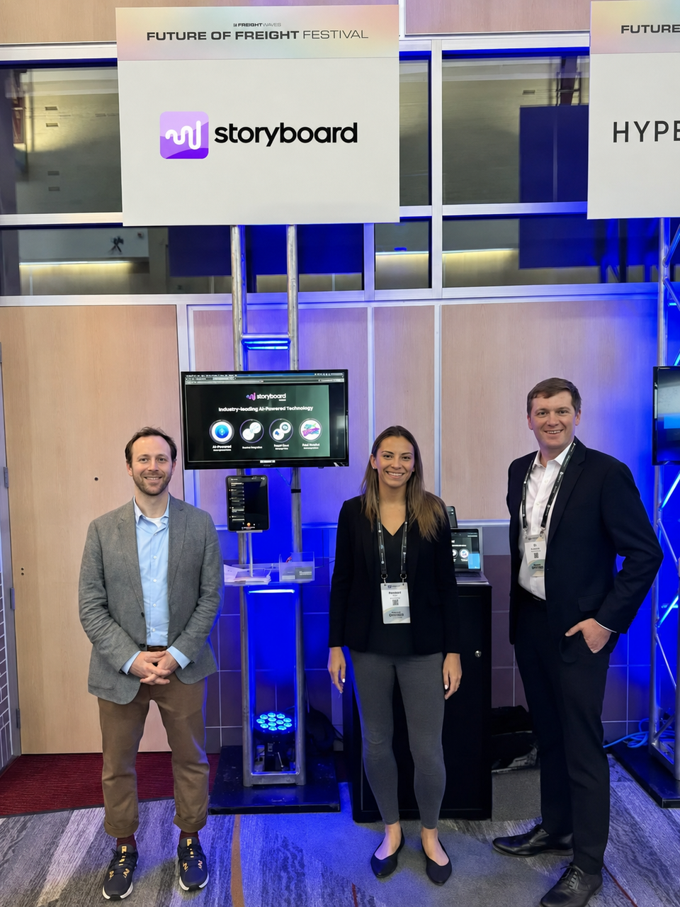 Leadership team in booth at trucking conference