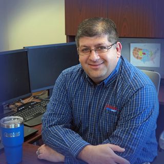 Deen Albert, VP of Operations at Grand Island Express, at his desk in the company office.